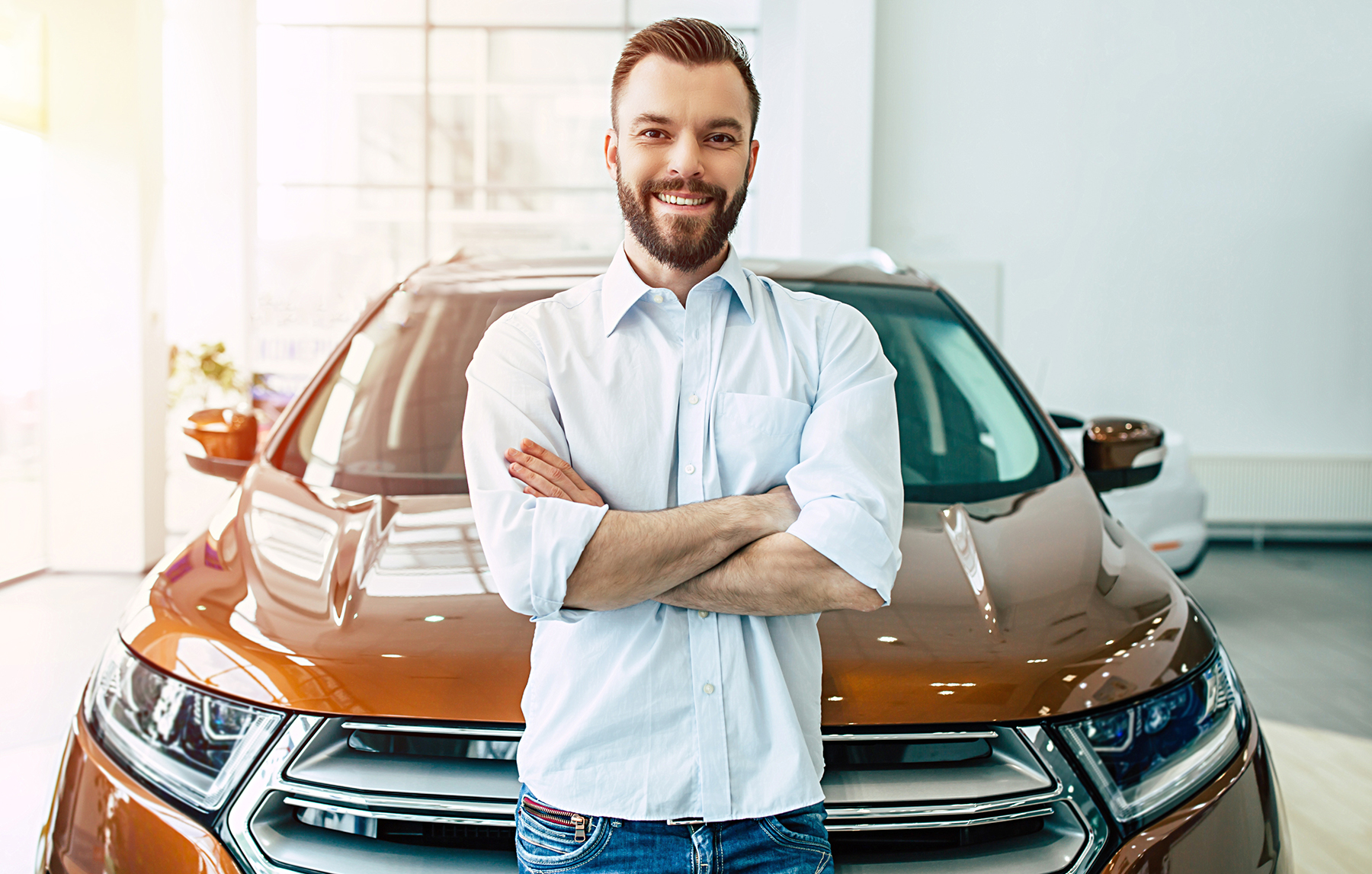 Man standing in front of car  - koinsurance.com